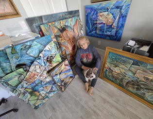 Artist surounded by her contemporary art